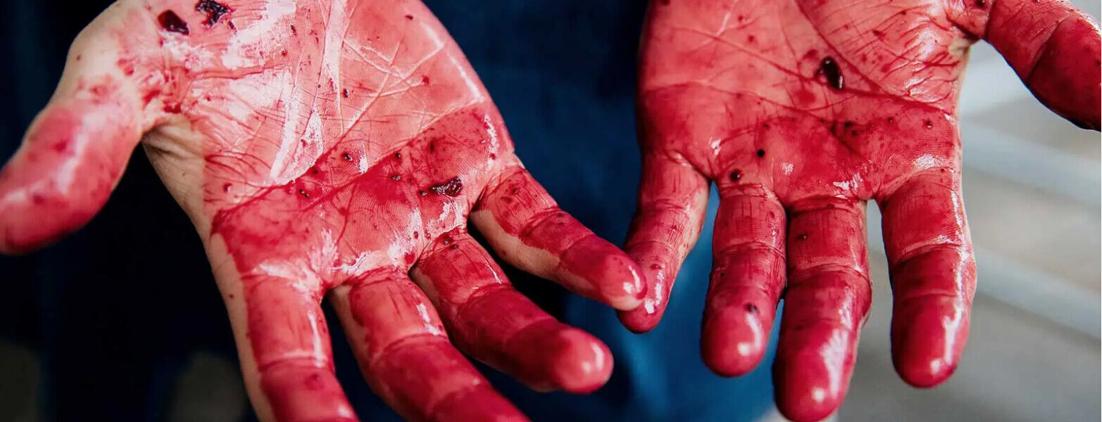 Grape juice painted hands