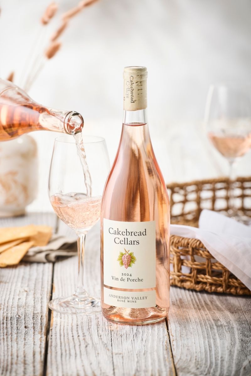 Bottle of wine with vineyard background